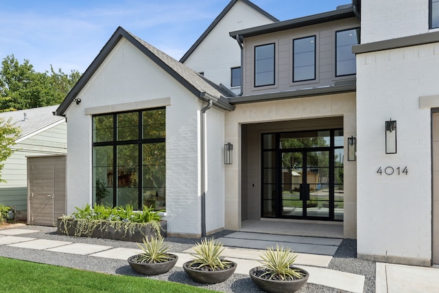 view of exterior entry featuring french doors