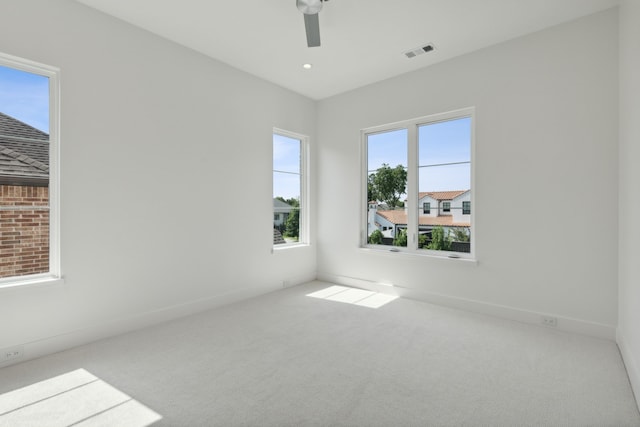 carpeted empty room with ceiling fan