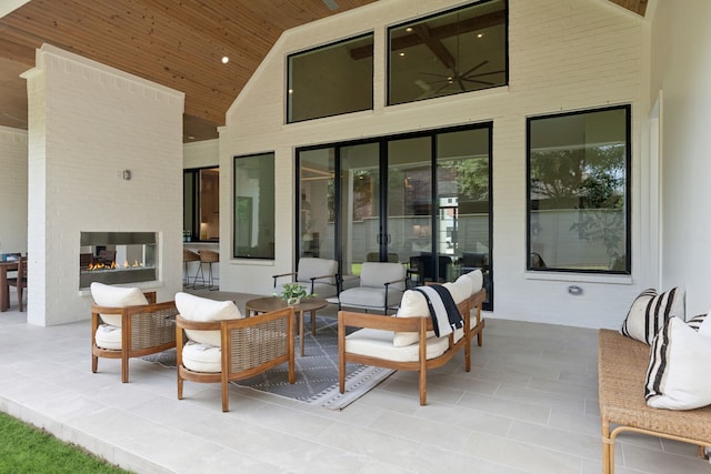 view of patio / terrace featuring an outdoor living space with a fireplace