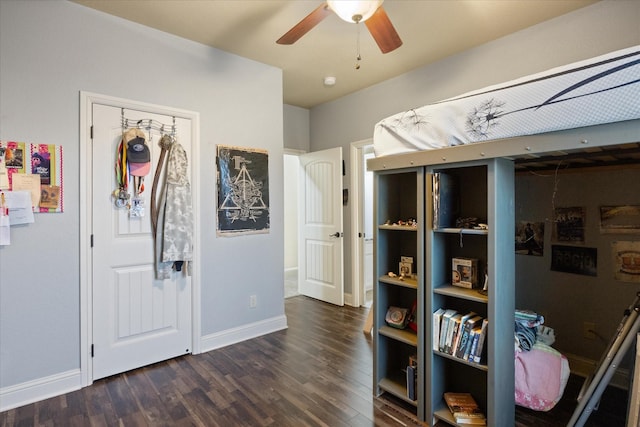 interior space with ceiling fan and dark hardwood / wood-style floors