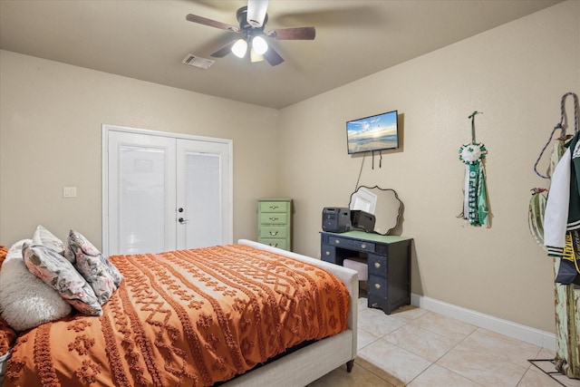 bedroom with light tile patterned floors and ceiling fan