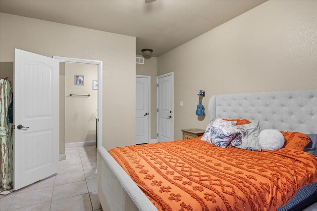 bedroom featuring light tile patterned floors