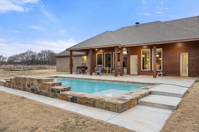 view of swimming pool featuring a patio