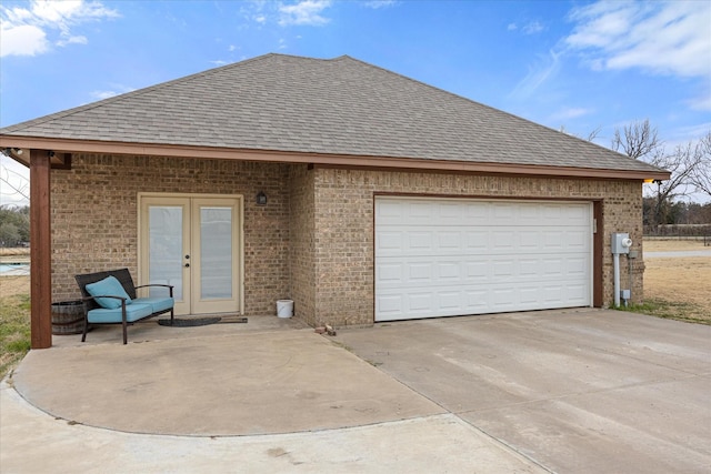 view of front of home featuring french doors and a garage