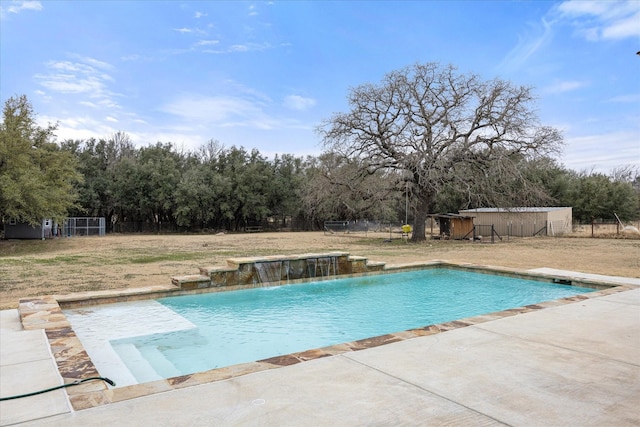 view of swimming pool with a patio area and pool water feature