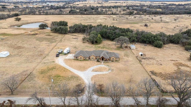 birds eye view of property with a rural view