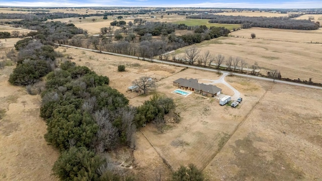 birds eye view of property with a rural view