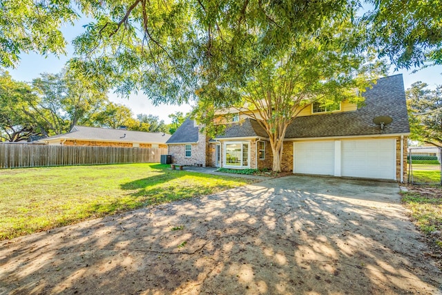 view of front of home featuring a garage and a front lawn