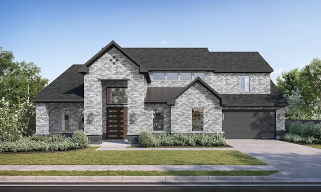 view of front of house with a garage and a front lawn