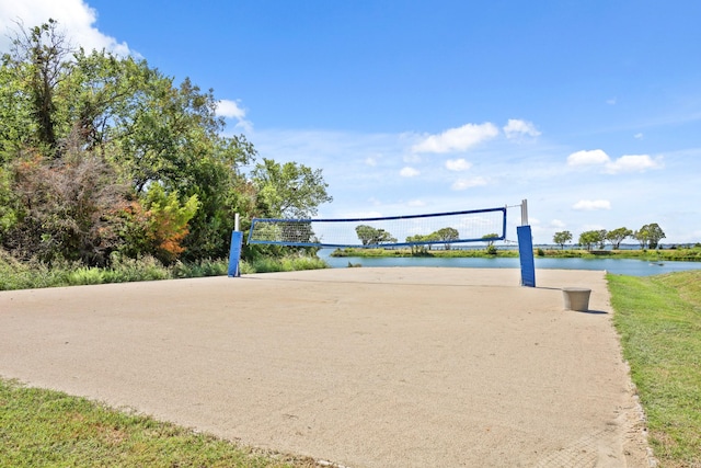 view of community featuring a water view and volleyball court