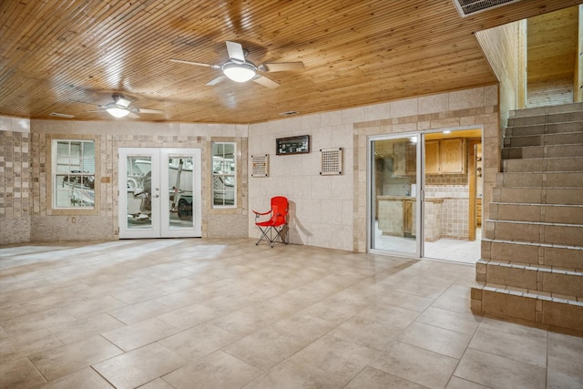 unfurnished room featuring french doors, ceiling fan, and wooden ceiling