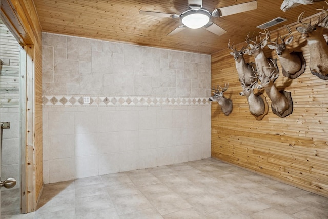 spare room with ceiling fan and wooden ceiling