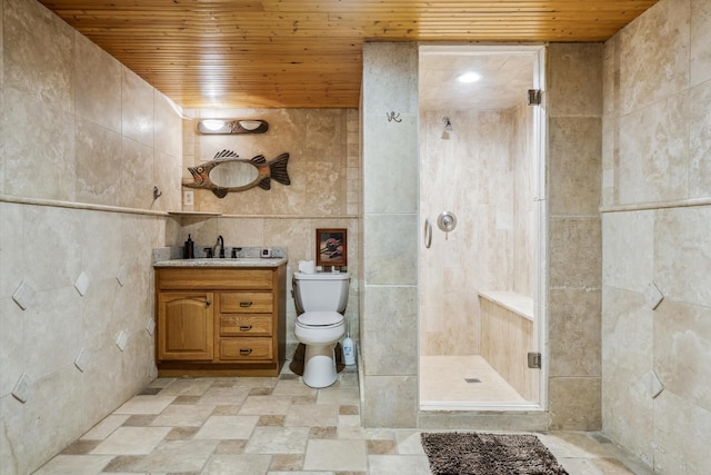 full bath with wooden ceiling, tile walls, a stall shower, and vanity