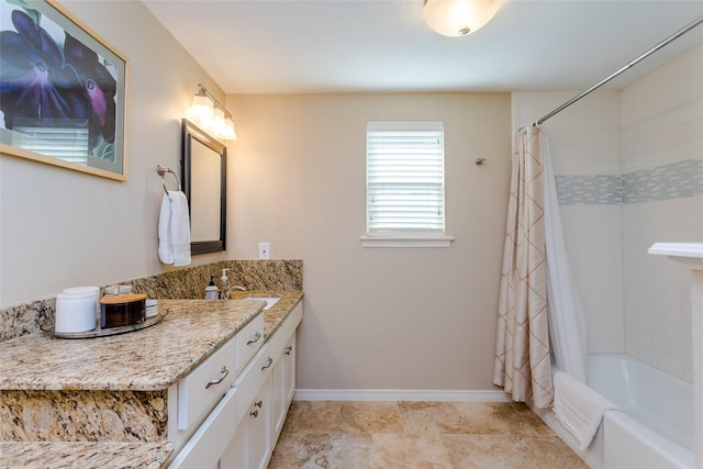 bathroom featuring vanity and shower / bath combination with curtain