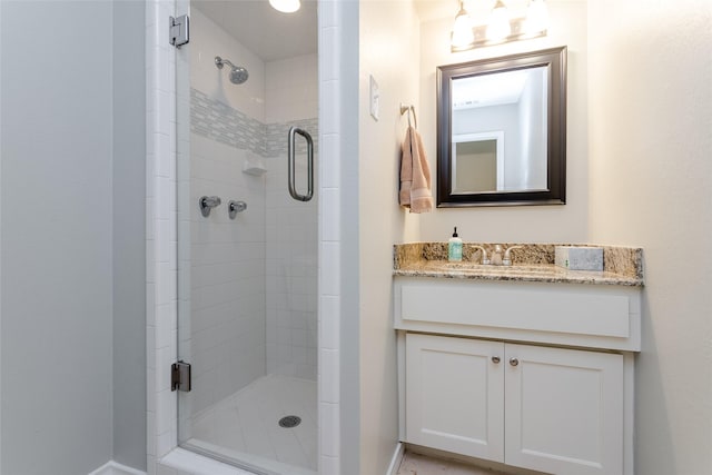 bathroom with vanity and an enclosed shower