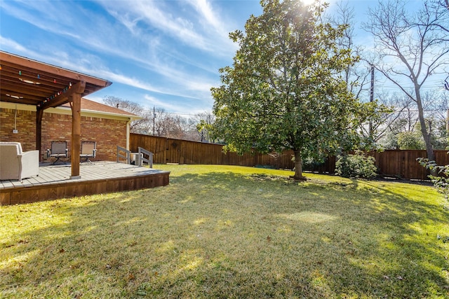 view of yard with a wooden deck