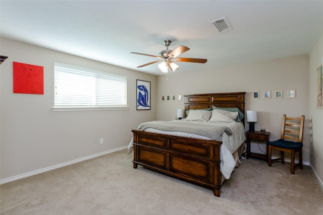 bedroom with light colored carpet and ceiling fan