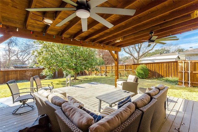 wooden deck featuring ceiling fan and an outdoor living space