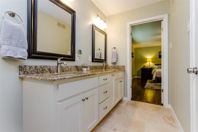 bathroom featuring vanity and crown molding