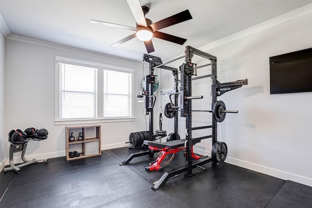 exercise area featuring crown molding, ceiling fan, and a textured ceiling