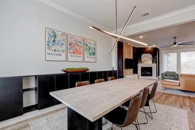 dining area featuring ceiling fan and light hardwood / wood-style floors