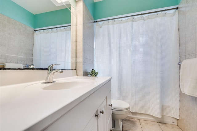 1241 Cypress Dr, Richardson, TX 75080 - full bath featuring toilet, tile walls, tile patterned flooring, and vanity