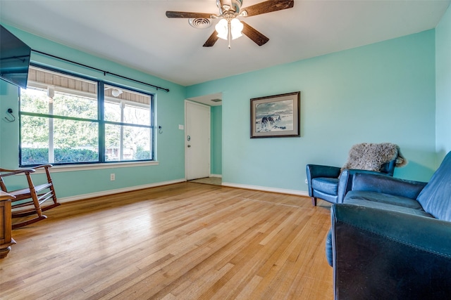 1241 Cypress Dr, Richardson, TX 75080 - living area with baseboards, a ceiling fan, and light wood-style floors