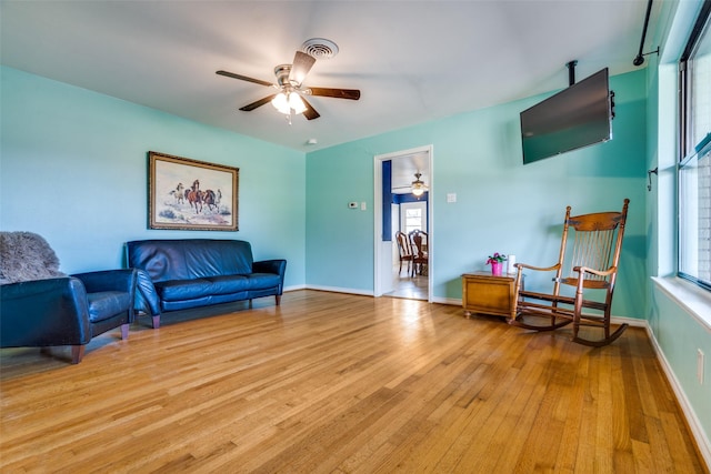 1241 Cypress Dr, Richardson, TX 75080 - sitting room featuring a ceiling fan, baseboards, visible vents, and light wood-type flooring