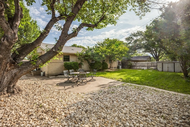 1241 Cypress Dr, Richardson, TX 75080 - view of yard with a storage shed, a patio, fence, and an outdoor structure