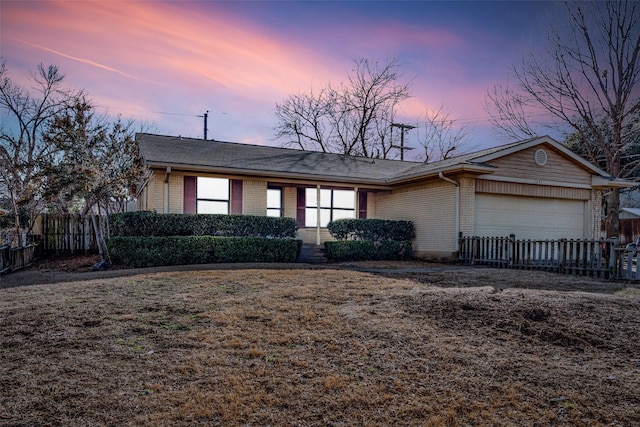 1241 Cypress Dr, Richardson, TX 75080 - ranch-style home with brick siding, a garage, and fence