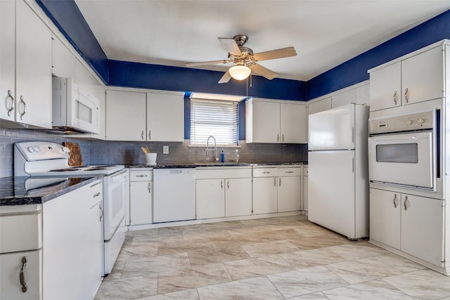 kitchen featuring white cabinetry, sink, ceiling fan, and white appliances