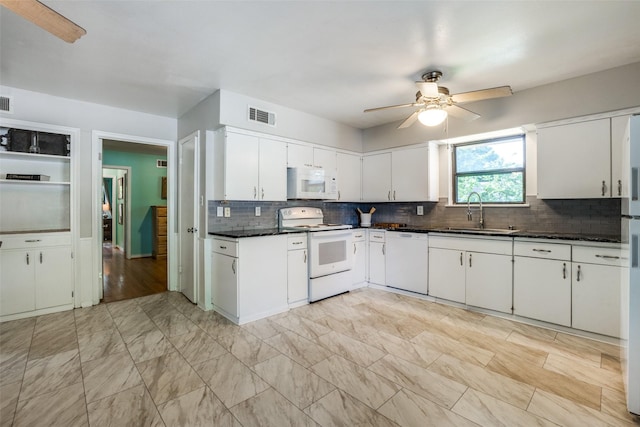 1241 Cypress Dr, Richardson, TX 75080 - kitchen featuring a ceiling fan, a sink, visible vents, white appliances, and decorative backsplash