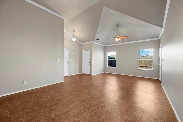 empty room with ceiling fan, ornamental molding, and lofted ceiling