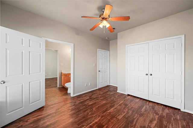 unfurnished bedroom with dark hardwood / wood-style flooring, a closet, ceiling fan, and ensuite bathroom