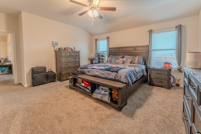 carpeted bedroom with lofted ceiling and ceiling fan