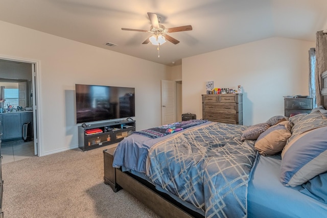 carpeted bedroom featuring vaulted ceiling and ceiling fan