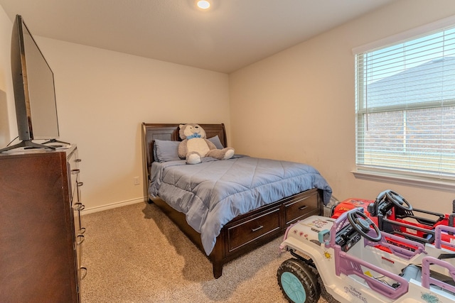 bedroom featuring light colored carpet