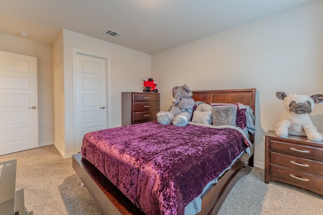 bedroom featuring light carpet