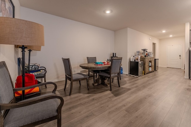 dining area with hardwood / wood-style flooring