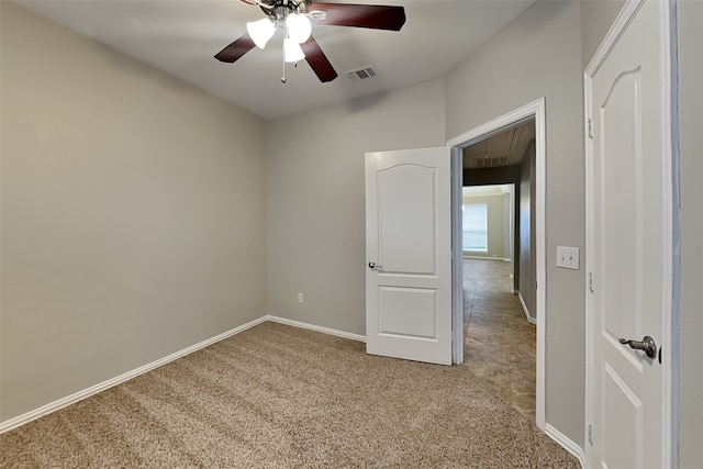 carpeted empty room with ceiling fan