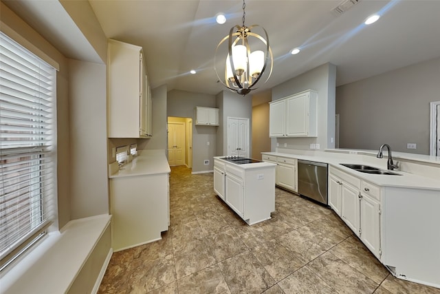 kitchen with decorative light fixtures, white cabinetry, lofted ceiling, sink, and stainless steel dishwasher