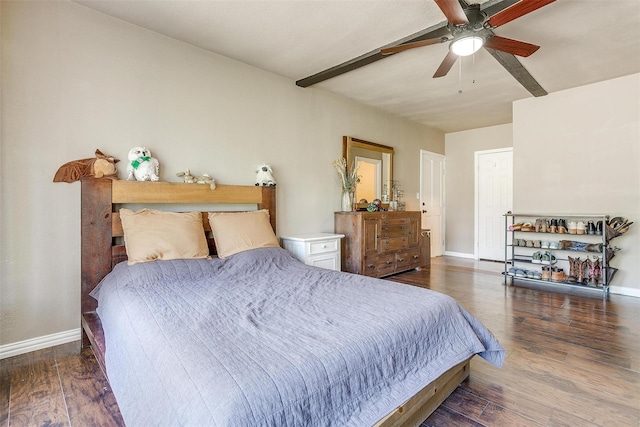 bedroom with dark hardwood / wood-style floors and ceiling fan