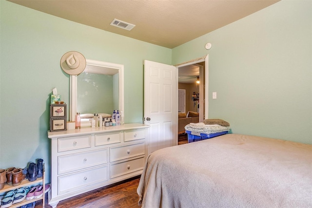 bedroom featuring dark wood-type flooring