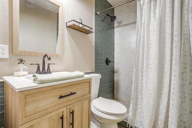 bathroom featuring vanity, toilet, and a shower with curtain