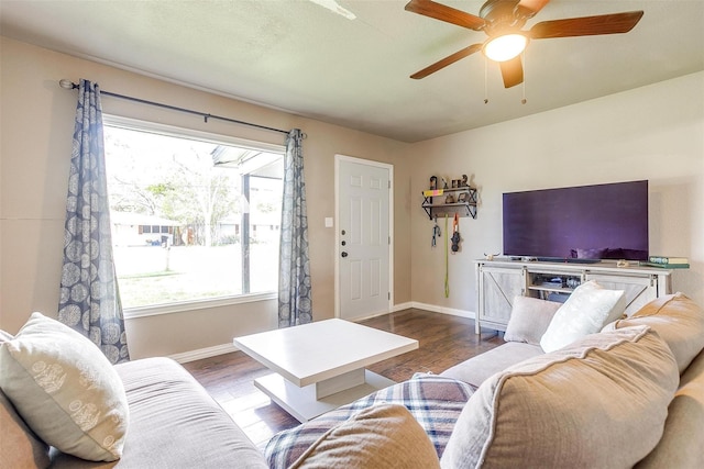 living room with wood-type flooring and ceiling fan