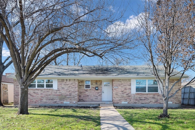 ranch-style home featuring a front yard