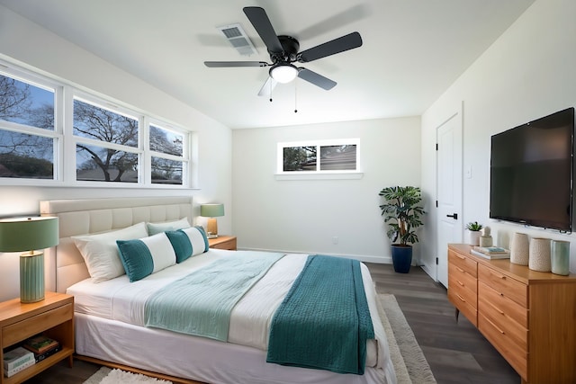 bedroom with ceiling fan and dark hardwood / wood-style flooring