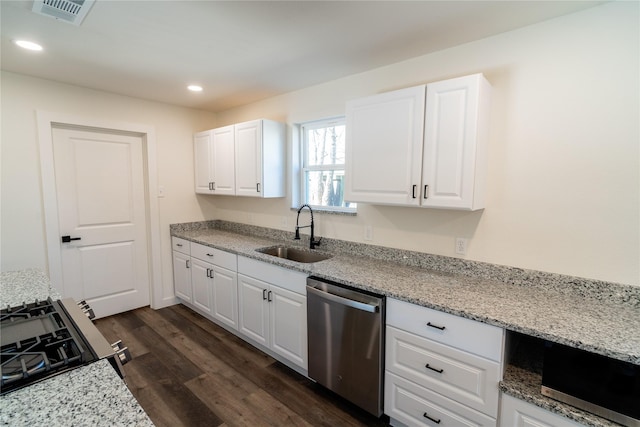 kitchen with white cabinetry, sink, and dishwasher