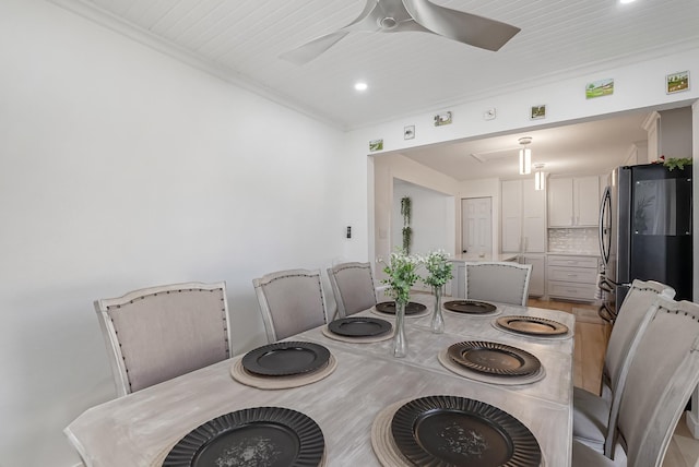 dining room featuring ornamental molding and ceiling fan