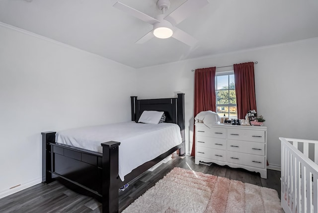 bedroom featuring ornamental molding, dark hardwood / wood-style floors, and ceiling fan